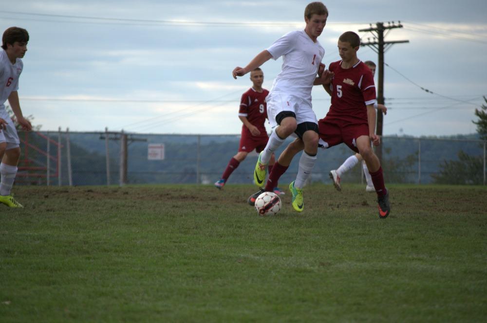 Senior Gage Kemerer steals the ball from an opponent.