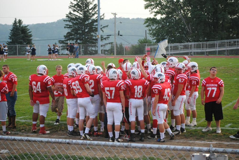 The football team gathers before their game on Sept. 20