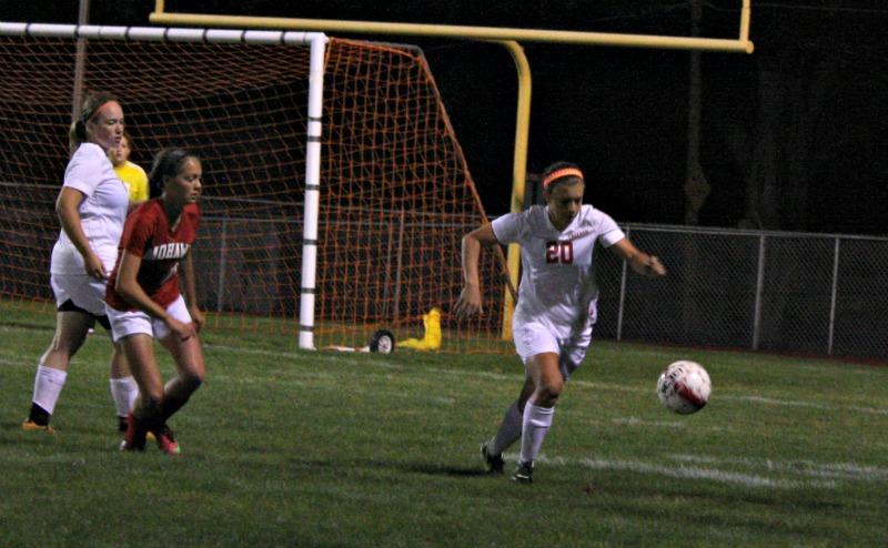 Junior Casey Spieler runs for the ball during a game against Mohawk to keep the
opponent from scoring.
