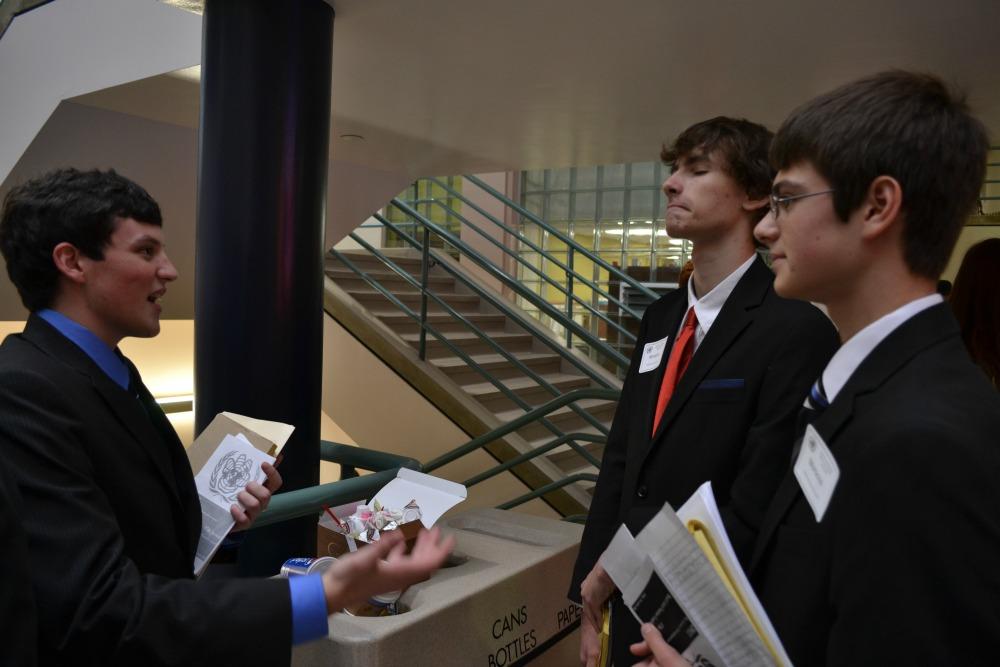 Senior Luke Hutchison, Junior Ryan Kaufman and Sophomore Louis Dubovi strategize during in the Model U.N. on Nov. 8.