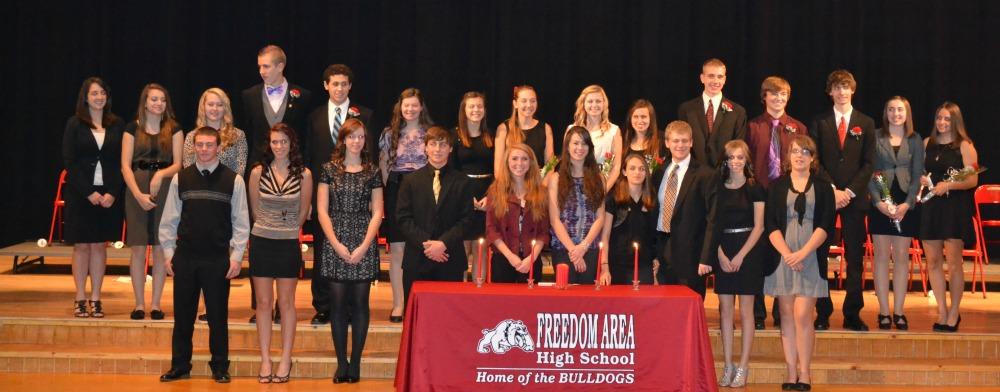 NHS+members+stand+at+the+conclusion+of+their+induction+ceremony+on+Nov.+7.+%28Front+row%3A+Senior+inductees.+Back+row%3A+Junior%0Ainductees.%29%0A