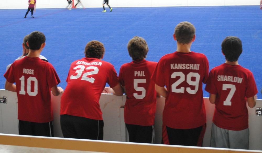 Freshman and sophomore team members watch their teammates fight for the ball in a game on Dec. 13.