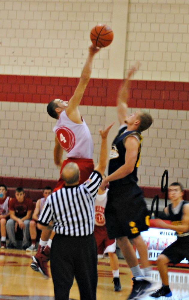 Junior Brenton Harrison jumps high for the ball in a game against Shenango on Dec. 3.