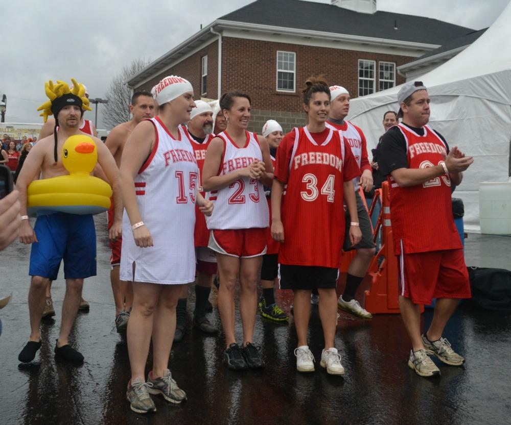 Members of FASD community and staff line up before they take their plunge into the Beaver River on Jan. 11.