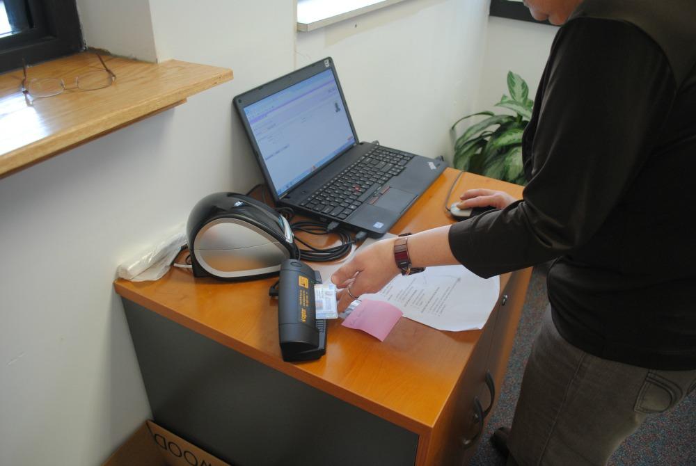 The new Raptor system in the main office allows secretaries to make passes for visitors using their driver’s license.