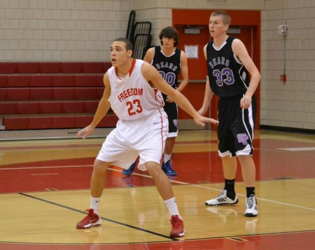 Junior Brenton Harrison plays defence in a game on DEC. 12 against Winchester Thurston.
