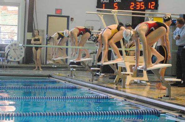 Senior Lauren Dubovi and Junior Heather Gazda get ready to swim in a meet at Quaker Valley on Feb. 12.