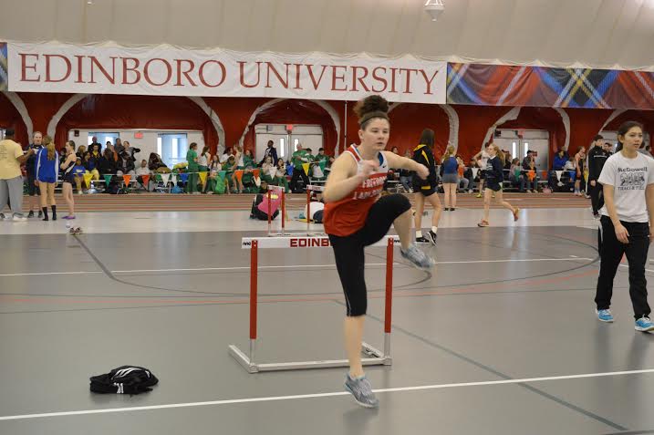 Junior Tina Davis warms up before her race on Feb. 1