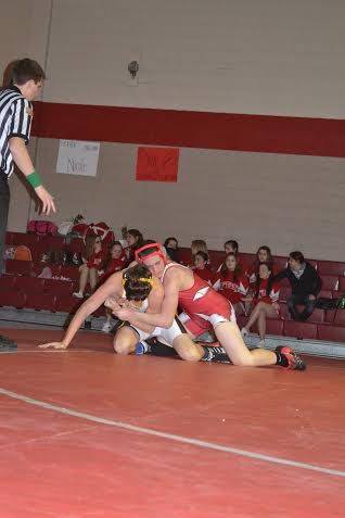Freshman Randy Simmons wrestles a competitor in a meet against South Side on Jan. 15.