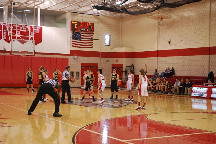 The girls’ basketball team prepares for tipoff in their game against South Side on Dec. 28.