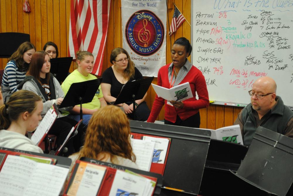 Ms. Alisha Murray assists Mr. Keith Kovalic by helping to prepare the chorus class for their upcoming concert.