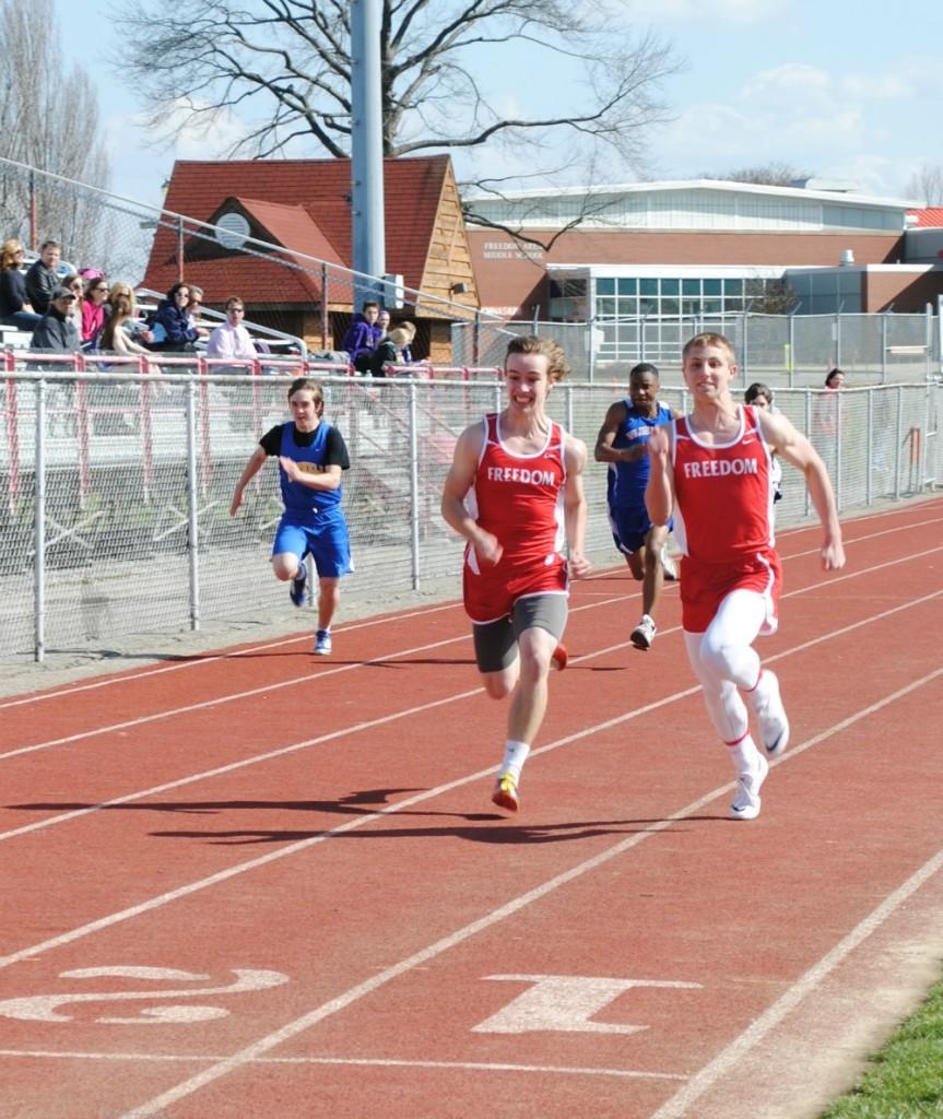 Junior Draek Boggs and Sophomore Erich Borgman sprint down the track in the 100 meter dash in a home meet against Wilkinsburg, Winchester Thurston and O.L.S.H. on April 8.