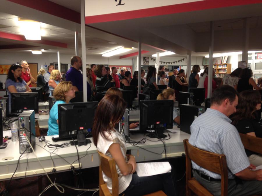 FASD teachers and community members fill the middle school library for the June 18 school board meeting.