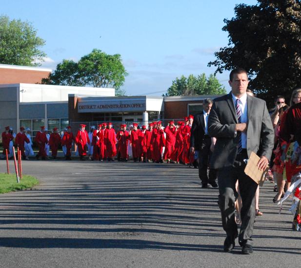 Hernandez leads the class of 2014 to Bulldog Stadium for commencement in June 2014.