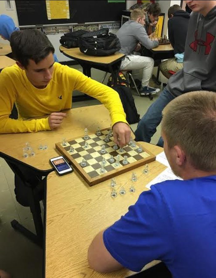 Chess club senior members Jarrett Boyd and Jordan Herzog play a one-on-one game.