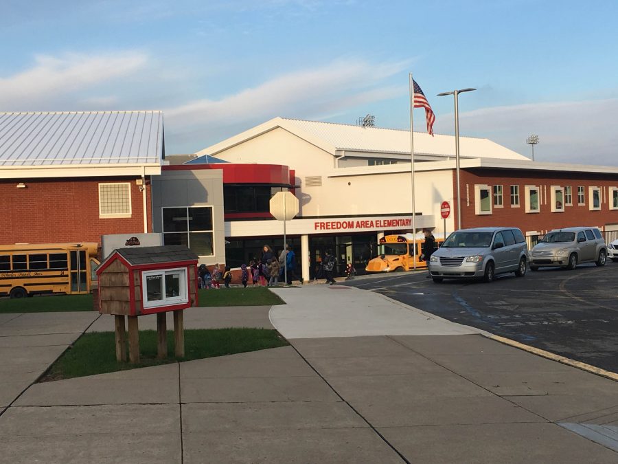 Students arrive at Freedom Area Elementary School for class on Dec. 5.