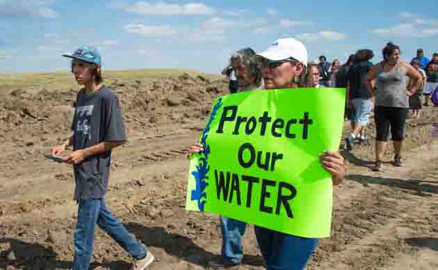 In a rally on Sept. 3, protesters use signs to demonstrate how the pipeline will negatively impact their environment and water resources.




 

Hundreds of Native American protestors and their supporters, who fear the Dakota Access Pipeline will polluted their water, forced construction workers and security forces to retreat and work to stop. / AFP / Robyn BECK / The erroneous mention[s] appearing in the metadata of this photo by Robyn BECK has been modified in AFP systems in the following manner: [A protest holds a sign reading Protect Our Water as Native Americans and their supporters walk on land designated for the Dakota Access Pipeline (DAPL), after protestors confronted contractors and private security guards working on the oil pipeline project, forcing them to retreat,  September 3, 2016, near Cannon Ball, North Dakota.] instead of [A protestor is treated after being pepper sprayed by private security contractors on land being graded for the Dakota Access Pipeline (DAPL) oil pipeline, near Cannon Ball, North Dakota, September 3, 2016.]. Please immediately remove the erroneous mention[s] from all your online services and delete it (them) from your servers. If you have been authorized by AFP to distribute it (them) to third parties, please ensure that the same actions are carried out by them. Failure to promptly comply with these instructions will entail liability on your part for any continued or post notification usage. Therefore we thank you very much for all your attention and prompt action. We are sorry for the inconvenience this notification may cause and remain at your disposal for any further information you may require.        (Photo credit should read ROBYN BECK/AFP/Getty Images)