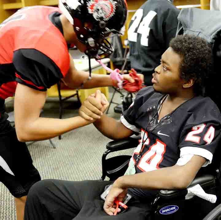 Former Aliquippa student and football player DiMantae Bronaugh shakes hands with a teammate before the WPIAL championship game on Nov. 18.