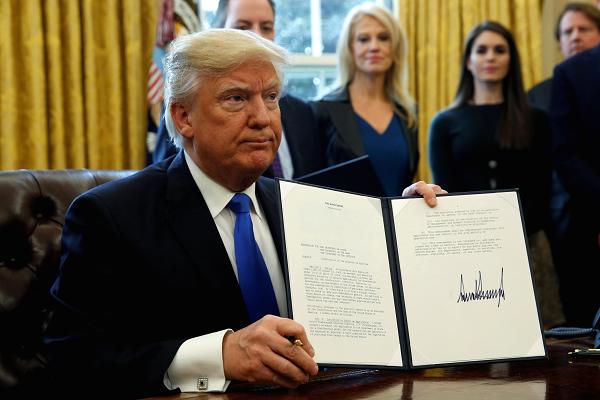 Trump signing the executive order for the Keystone XL pipeline Taken By CNBC.