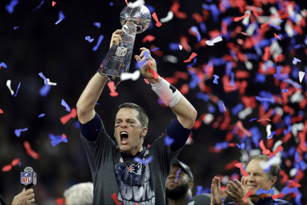 New England Patriots Tom Brady raises the Vince Lombardi Trophy after defeating the Atlanta Falcons in overtime at the NFL Super Bowl 51 football game Sunday, Feb. 5, 2017, in Houston. The Patriots defeated the Falcons 34-28. (AP Photo/Darron Cummings)