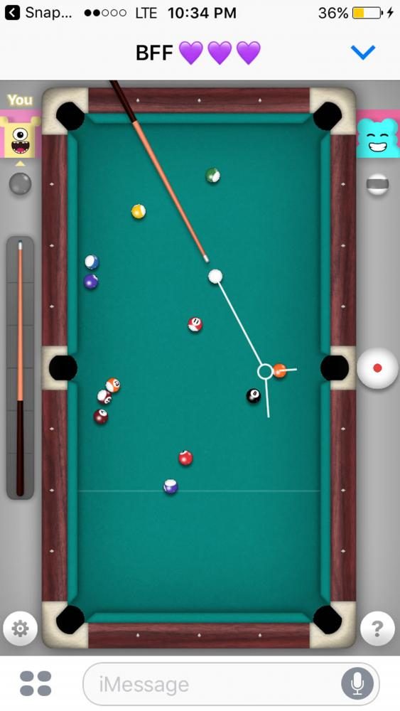  A game of 8-ball is played between two friends in the new iMessage feature. 
