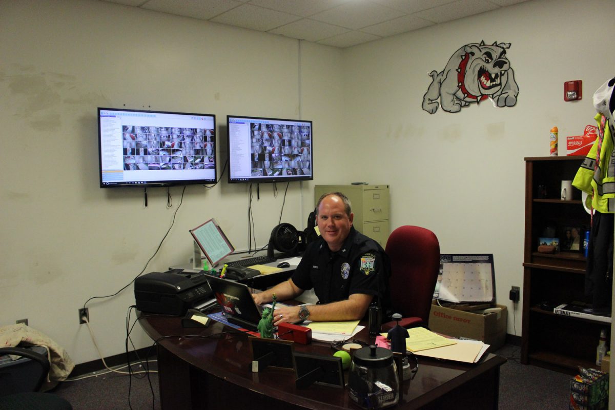 Resource+Officer+Tom+Liberty+sits+at+his+desk+in+his+new+office+space.