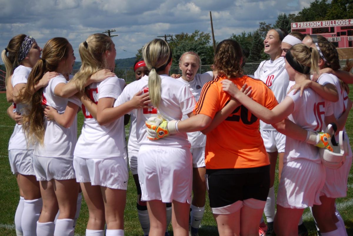 On me! On we! The girls huddle up to get their adrenaline pumping before taking on Keystone Oaks.