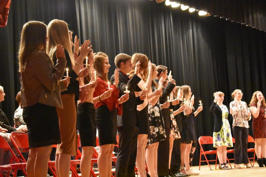  The new members, Jordyn Wright, Melissa Keith, Robin Kaufman, Claudia Huggins, Taylor Greene, Carson Gilarno, Marydeth Feits, Jenna Engel, David Eisenbrown, Kassandra DePoppe, Joshua Beck, Alexsia Barlamas and Myla Sharpless take the oath to be entered into NHS.