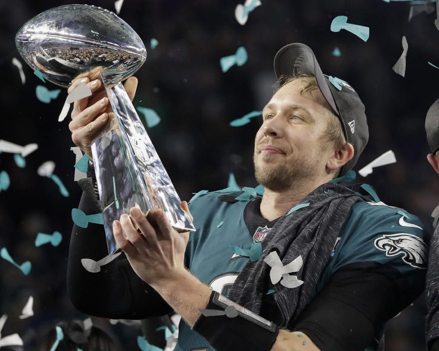 Super bowl MVP Nick Foles holds the Lombardi Trophy high after winning it for the first time.