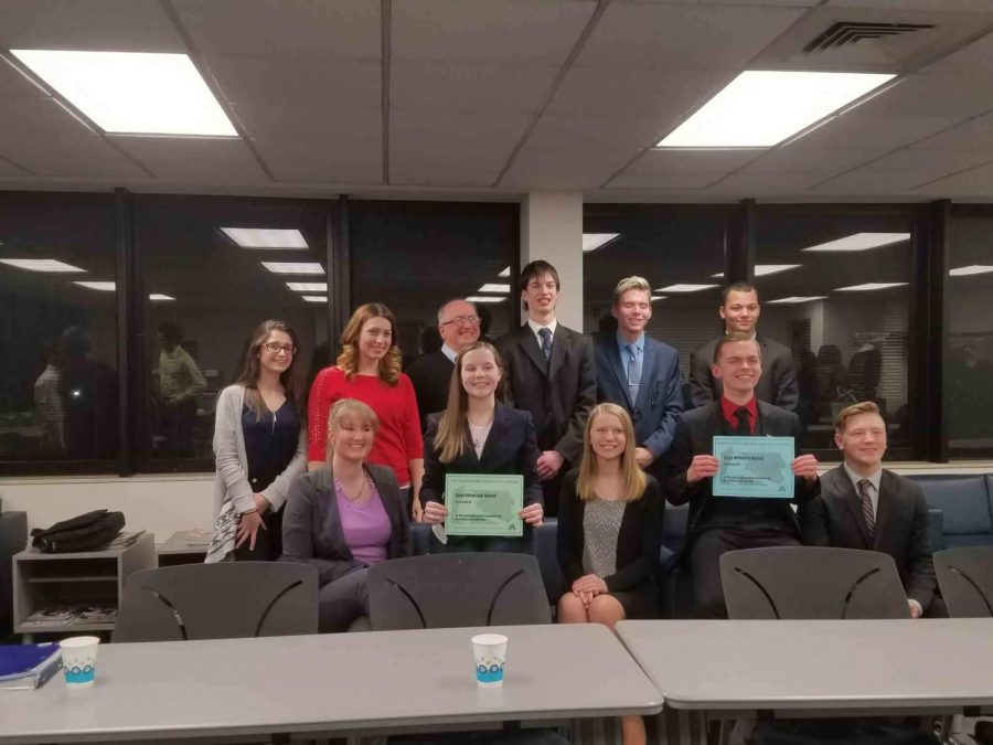 The New Brighton mock trial team stands together for a photo after the regional competition.
