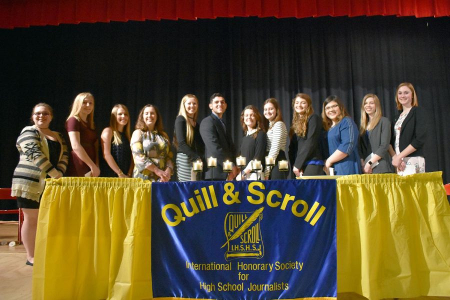 The new members of the Quill and Scroll Society at Freedom pose together at the end to commemorate their new membership.