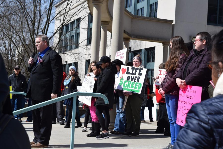 Attendees of the March For Our Lives rally at the Beaver County Courthouse stand behind Joe McGurk, a candidate for the 10th PA House District, as he gives his speech on gun-safety legislation on March 24.