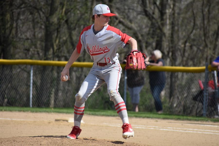 Junior David Jansen prepares his windup to pitch against Laurel opponent.
