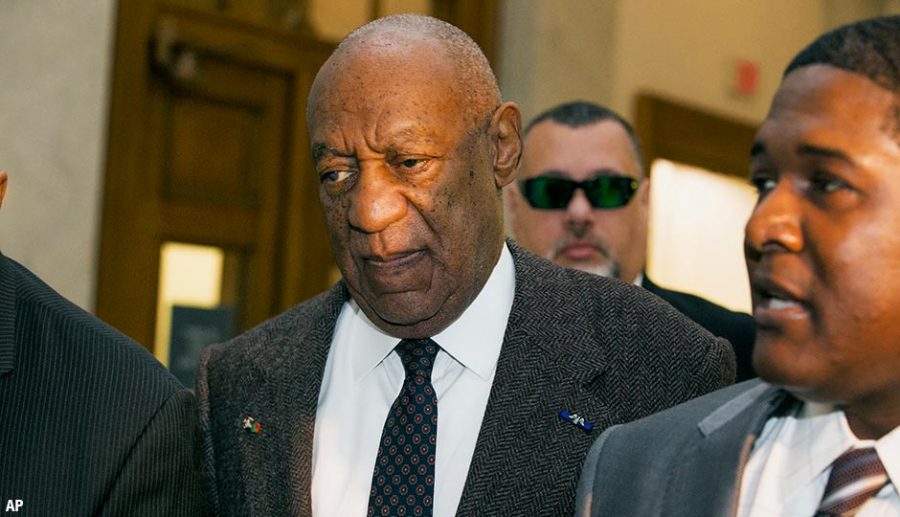 A disdained Bill Cosby (center), is seen walking into court on Wednesday, February 3, 2016. 
