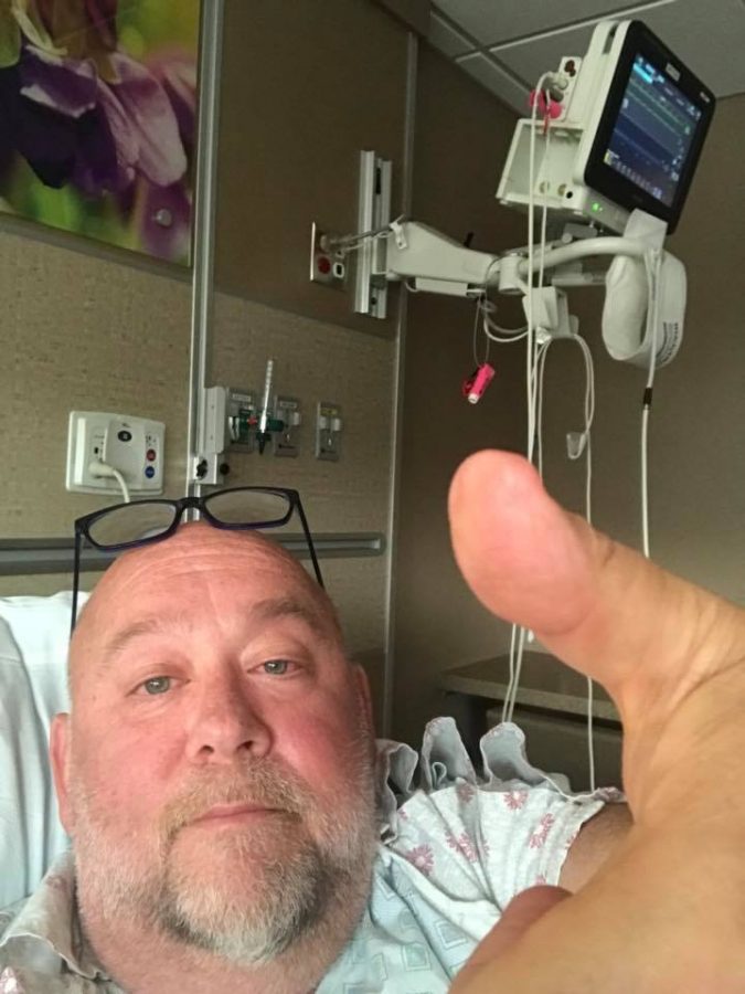 Kovalic takes a picture of himself giving a thumbs-up to the band, in order to recognize that his surgery went well. 