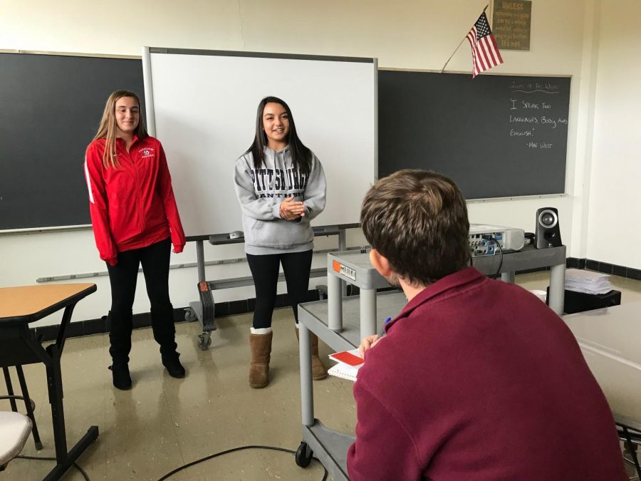 Sophomores Jessica Scheel and Madison Lewis practice a roleplay for Adviser Bradley Baldwin to start practicing for the actual competition in December.