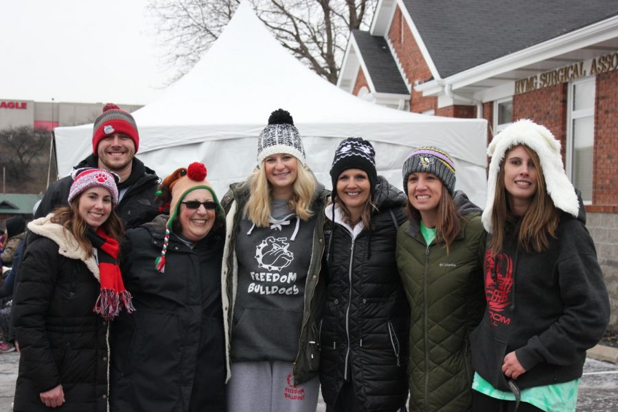 The eight faculty members stood together to take a picture after they took the plunge. 