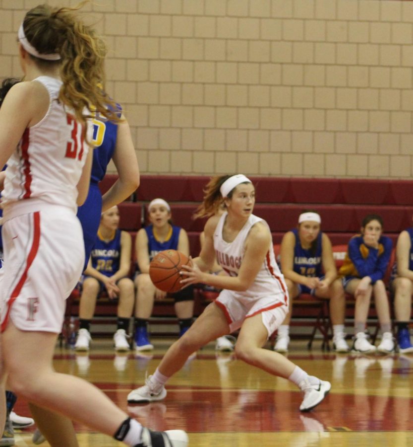 Freshman player Renae Mohrbacher searches for a teammate to pass to during the second quarter of the Lady Bulldogs final game of the season on Feb. 11.