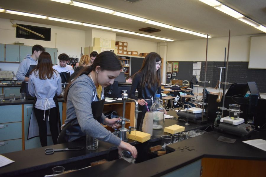 Sophomore Lauren Lizzi and freshman Erin Harp work to complete their lab in chemistry, utilizing the eighty minute block. A schedule change to forty minutes would make a lab like this difficult to complete.