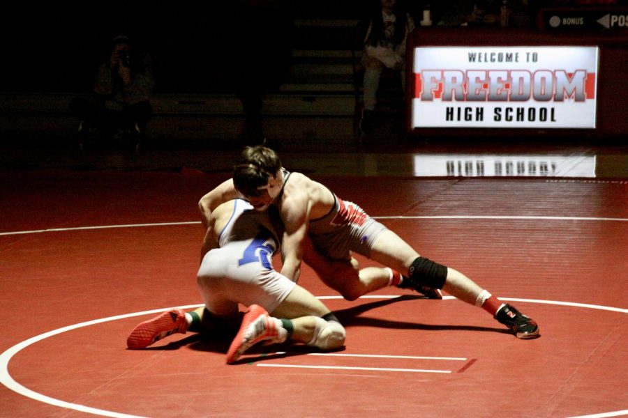 Wrestlers+continue+to+perform+at+matches+throughout+the+season+even+though+weight+cuts+and+training.+