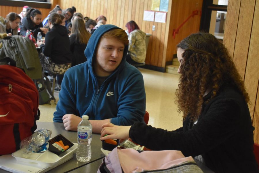 On+Feb.+19%2C+seniors+Nathan+Galderisi+and+Ashley+Kanchat+engage+in+a+conversation+during+their+lunch.