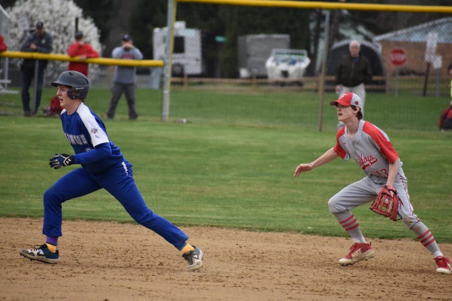 Senior David Jansen gets ready for the ball to be thrown to him from third base at the start of a rundown during the top of the third inning against Lincoln on April 8.