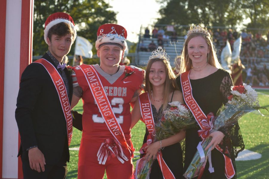 Last year’s Homecoming King and Queen Riley Adams and Melissa Keith crown Maxwell Ujhazy and Baylee Stewart as this year’s Homecoming King and Queen. 