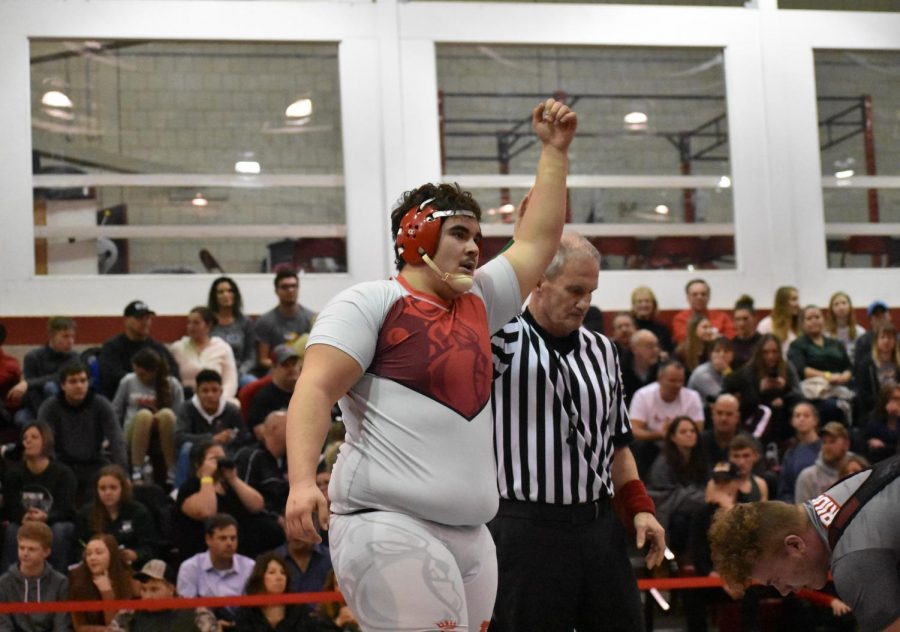 Senior Fernando Franco raises his fist into the air after a match in the bulldog’s gymnasium on Jan. 4-5 in the previous season.