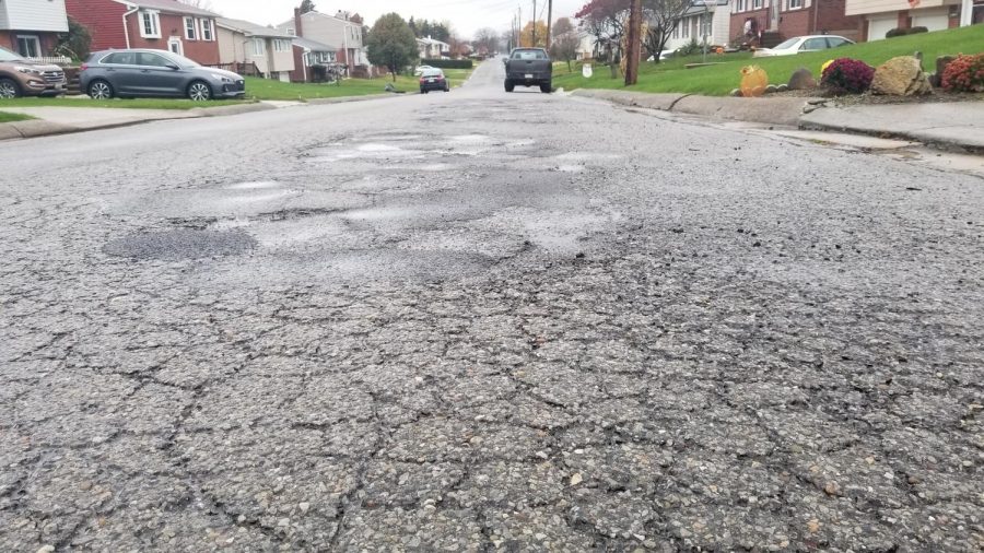  Cluster of potholes on Foote Street in Conway. This group of potholes, and many more, can be seen all over the rest of Conway and the numerous bad roads throughout the district. 