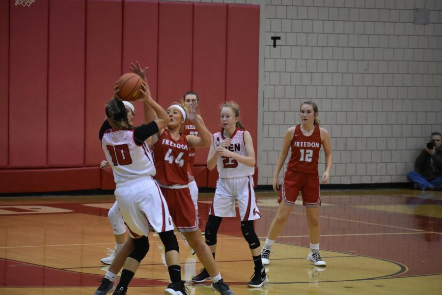 Junior Karissa Mercier blocks a shot from the opposing team Dec. 6 against Eden Christian.