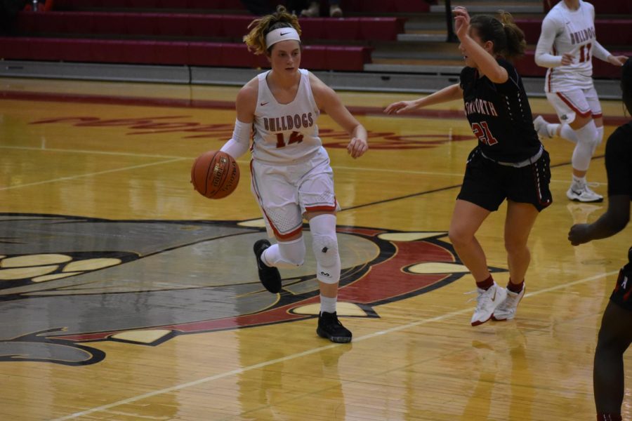  Freshman Julia Mohrbacher attempts to weave through her opponents defense at the game against Avonworth on Feb. 6.