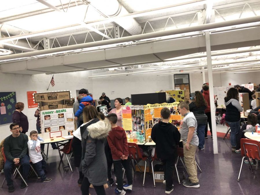 Students and their guardians peruse the different projects made by participants.
