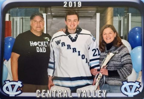 This photo of Mark, Sam, and Renae Romutis was taken at the Central Valley Hockey Senior night, the hockey team that Sam played for.