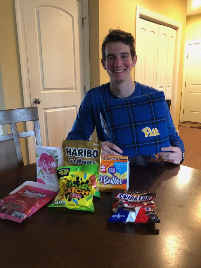 
Senior Hunter Black receives many different kinds of candy along with a Pitt pillow from his adoptee. 
